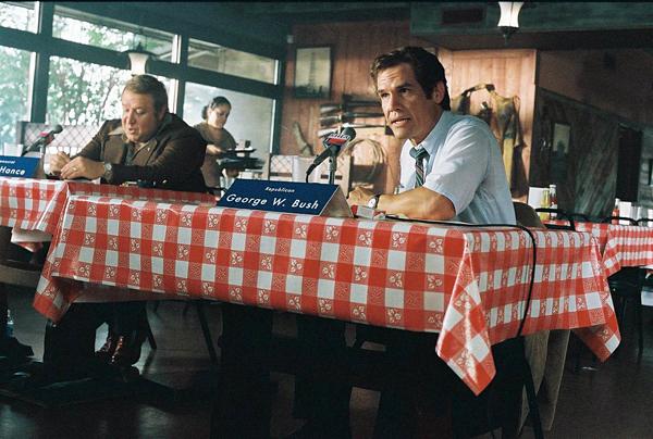 Josh Brolin (right) gives a wonderful performance of our most widely hated recent president. - www.AllMoviePhotos.com