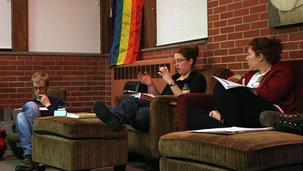 In the Stonewall Resource Center, students Jon Richardson ('10) and Leah Krandel ('09) take part in the bible discussion led by Lily Fellow in Religious Studies, Katie Snipes. - Paul Kramer