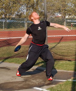 Curtis McCoy '10 winds up and throws the discus during Monday's practice out at Les Duke track. - Sophie Fajardo