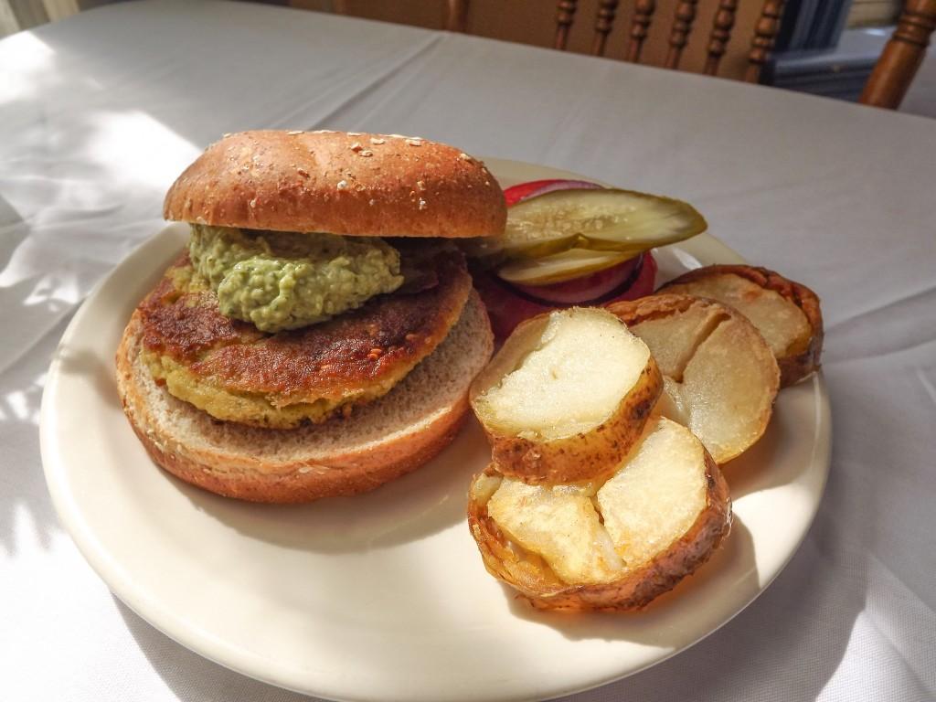 Relish’s Chickpea Burger, with potato medallions and fresh vegetables.  Photo by Eric Mistry.
