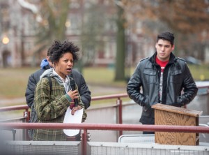 Briona Butler ‘15 talks about her experience as a victim of drive-by harassment; Eric Brito ’16, one of the rally’s organizers, looks on. Photo by John Brady.