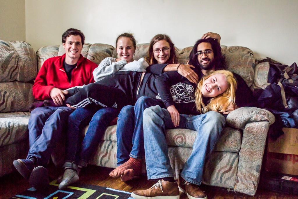 Mackenzie Shanahan gets comfortable with her four housemates, Arthur Richardson, Liberty Britton, Jeanette Miller and Aaltan Ahmad (all ’14), who lovingly caress her in their arms. Photo by Chris Lee.