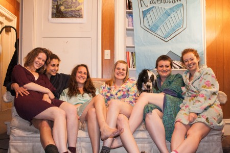 Naomi Ramsay, Lucy Marcus, Caitlin Beckwith-Ferguson, Marta Andelson, Merlin the dog, Kate Loftur-Thun and Gracie Brandsgard (’14) take it easy in their robes. Photo by Tela Ebersole