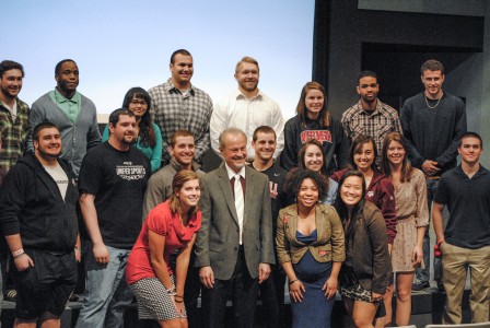 Human rights activist Richard Lapchick poses with students in Harris on Tuesday. Photo by Connie Lee.