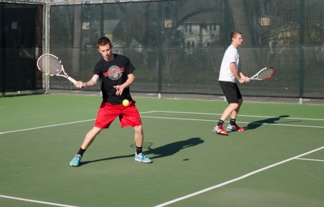 Rob Storrick ’15 and Bryson Cale ’16 practices a rally on Tuesday, April 22. Photo by Shadman Asif. 