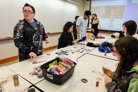 Students make buttons at a body positivity Pride Week event sponsored by GoGo. Photo by Mary Zheng.