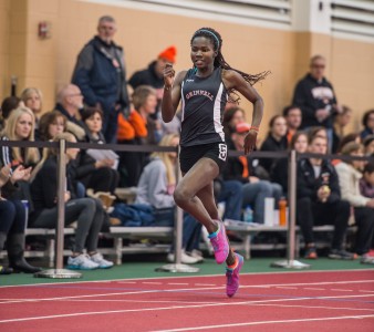 After tying her school record in the 400-meter dash, Christine Ajinjeru ’14 hopes to qualify for Drake Relays. Photo by John Brady. 