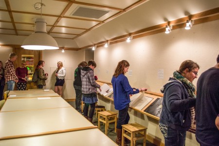 Students admire books on display in the Print Study Room. Photo by Chris Lee