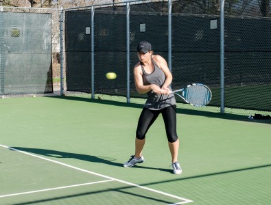 Clothilde Thirouin ’14 returns a backhand at practice. Photo by Shadman Asif. 