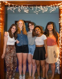 Fabiola Barrall ’15, Rosalie Curtin ’15, Audrey Smith ’15, Quinnita Bellows ’15, and Yang West ’15 (left to right) pose under the lights in “The Landing Strip.” Photo by Tela Ebersole.