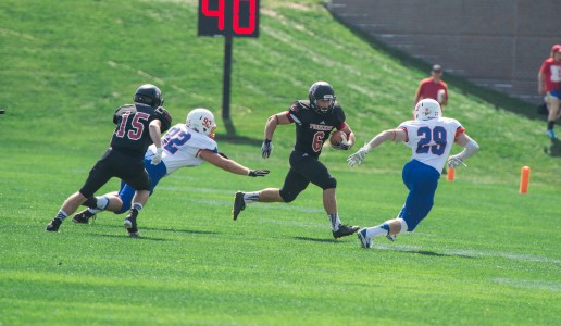 Jacob Bernholtz ’17 rushes against Macalester College last Saturday. Photo by John Brady. 