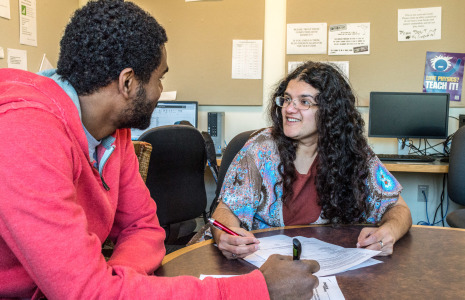 Minna Mahlab works with Post-Baccalaureate Fellow Keneil Brown ’14 in Noyce Science Center. Photo by Jun Taek Lee.