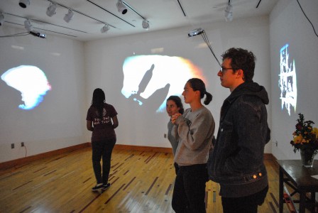 Students survey "Remote" in Smith Gallery. Photo by Parker Van Nostrand.