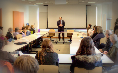 Ahmed Ali ’06 answers audience members’ questions about ISIS in JRC 209.  Photo by Megan Pachner.