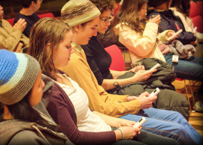 Students use clickers to poll their opinions on sustainability. Photo by Shadman Asif.