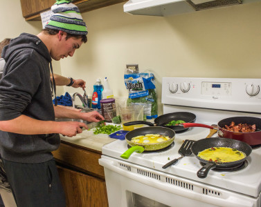 Sam Sokolsky '17 prepares omelets at the reopening of Golden Dick. Photo by Sara Ruiz