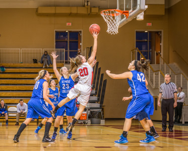 Lydia Stariha ’17 reaches for the ball against Illinois College on Tuesday. Photo credit Chris Lee.