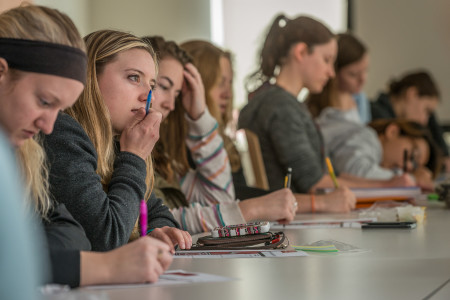 Members of the Female Athlete Leadership Series discussing issues in the Grinnell athletic community.  Photo by Chris Lee