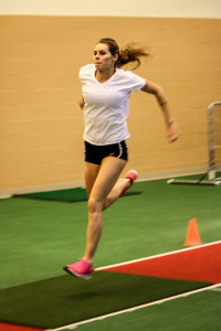 Eloise Miller ’15 long jumps in practice this week.  Photo by Leina'ala Voss