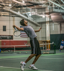 Caleb Kumar '16 serves during practice this week.  Photo by Chris Lee