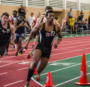 Ed Hardman ’16 and his team placed fourth in the 4x200 relay event.  Photo by Jun Taek Lee
