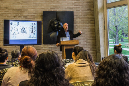 As part of APIA week, Joe Orser, a Professor of History at U of WI - Eau Claire, discusses his book about historical Siamese twins on Tuesday, April 28, in Burling Lounge. Photo by Rae Kuhlman.
