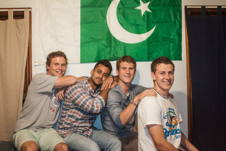 From left: Teammates Bryson Cale, Ameer Shujjah, Tracy Johnson, and CJ Ray (all ’16) in front of the Pakistani flag. (Photo by Tela Ebersole)