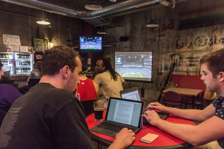 Tim Sherwood ’16 (left) and Tristan Knoth ’17 (right) watch Monday Night Football in Lyle’s Pub.  Photo by Sam Catanzaro