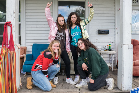 From left: Anna Transit, Jenny Samuels, Eliza Harrison and Sophie Donlon (all ’16) pose on their trademark front porch. (Photo by Takahiro Omura)