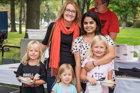 Avantika Johri ’18 (upper right) poses with her host family at the ice cream social during Family Weekend. (Photo Contributed)