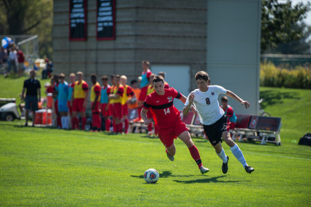 Antonio DiMarco ’18 battles for control of the ball versus Ripon last Saturday. In the game, DiMarco took three shots on goal.  Photo by Minh Tran.