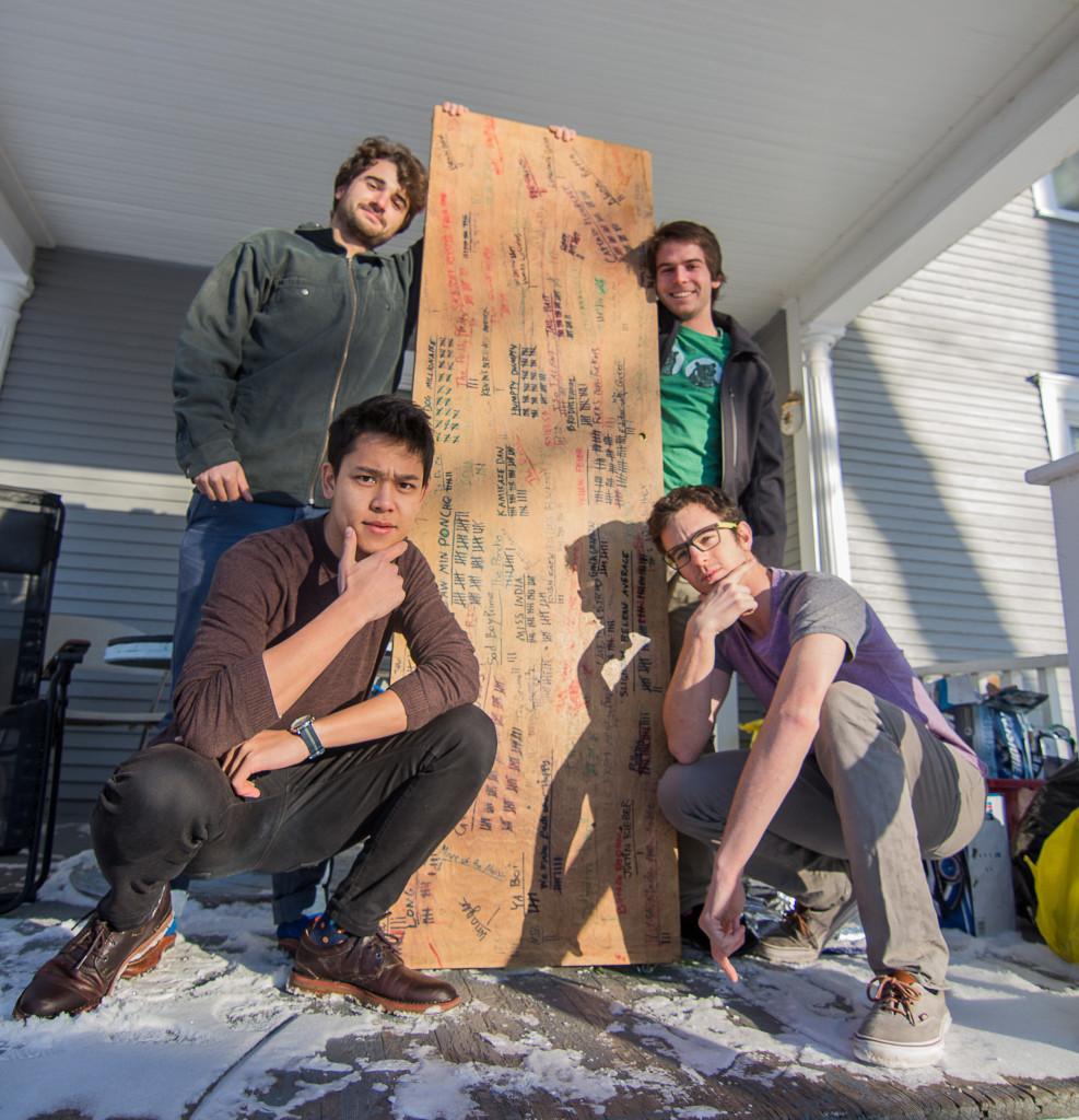 Misha gelnarova From left: Saw Min Maw ’16, Sam Catanzaro ’16, Beau Bressler ’16 and Cole Miller ’17 pose with their beloved beer die table, nicknamed “The Book of Mormon.” Photo by Misha Gelnarova.