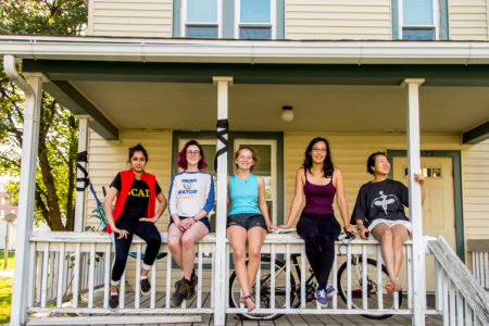 Radhika Malaviya ’18, Anna Warm '19, Vivian Cheslack '19, Leina’ala Voss ’18 and Jinlin He '18 sit on the porch of Art House, a new project house. Photo by Garrett Wang. 