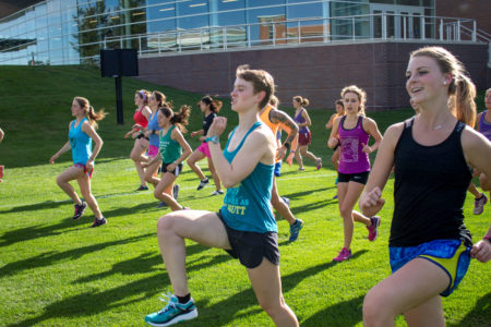 The Women's cross country team prepares for the home meet.