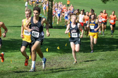The men's cross country team race to the finish line at Les Duke.