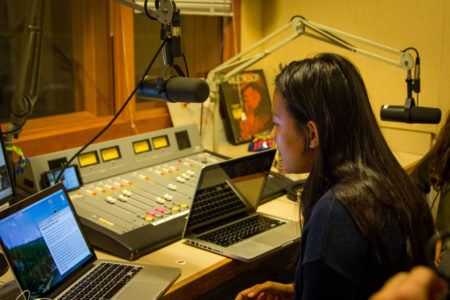 Ceci Bergman '19 recites poetry and jokes on "The Mom Cave Show," a show hosted by Steven Duong '19 that's on its second year running. Photo by Hung Vuong.