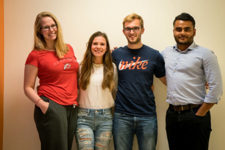 Photo by XiaoXuan Yang. Ashleigh Bull '17, Christine Hood '17, Phil Gemmel '17 and Nirabh Koirala '17 plan events for and offer advice to other Political Science majors. 