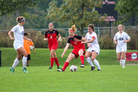 Midfielder Lauren Hurley  18 fights hard fo rthe ball during a match over fall break. Photo contributed.