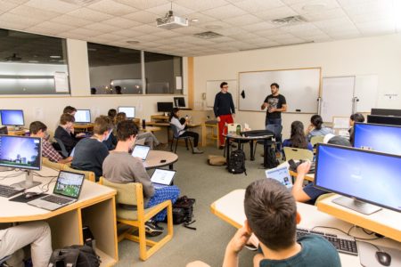 Students interested in finance discuss how to invest a 160,000 dollar portfolio. Photo by Garrett Wang. 