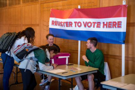 jeff li  Students register others to vote outside of the Spencer Grill in the JRC. 