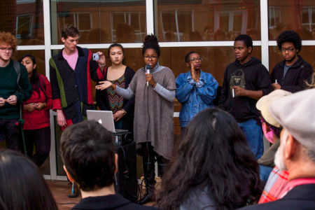 Simonne Carlton '18 addresses students in the JRC.