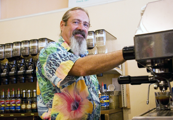 Jeff Phelps '71, owner of Saint's Rest Coffee House on Broad Street, pulls his shots of morning espresso to start the day off right.Ami Freeberg.