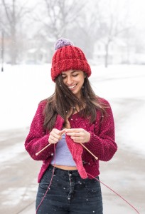 Cassie Nedoroski ’14 shows off her knitting skills. Photo by John Brady.