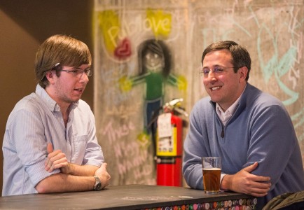 PUBtalks organizer Ben Doehr ’14 and Professor Michael Guenther chat during the talk on Feb. 27. Photo by John Brady.