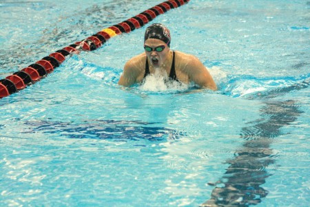 Maddie Gray ’16 swims breaststroke at Conference last weekend. Photograph by Tela Ebersole.  