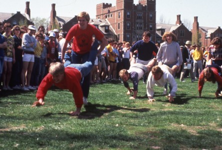 Students partake in a wheelbarrow race at the Grinnell Relays of 1984. Photo contributed.